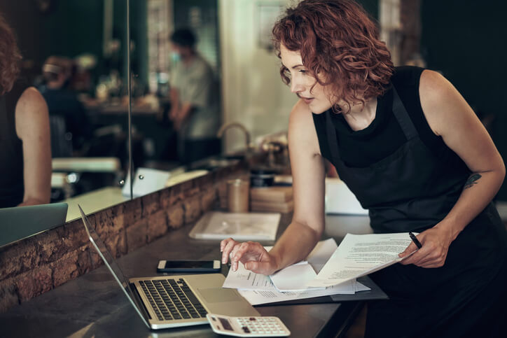 A cosmetology graduate performing accounting duties while owning a beauty salon