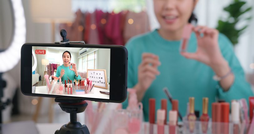 Influencer going live on social media to showcase cosmetology skills