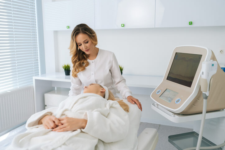 Beauty professional using skincare tools during training